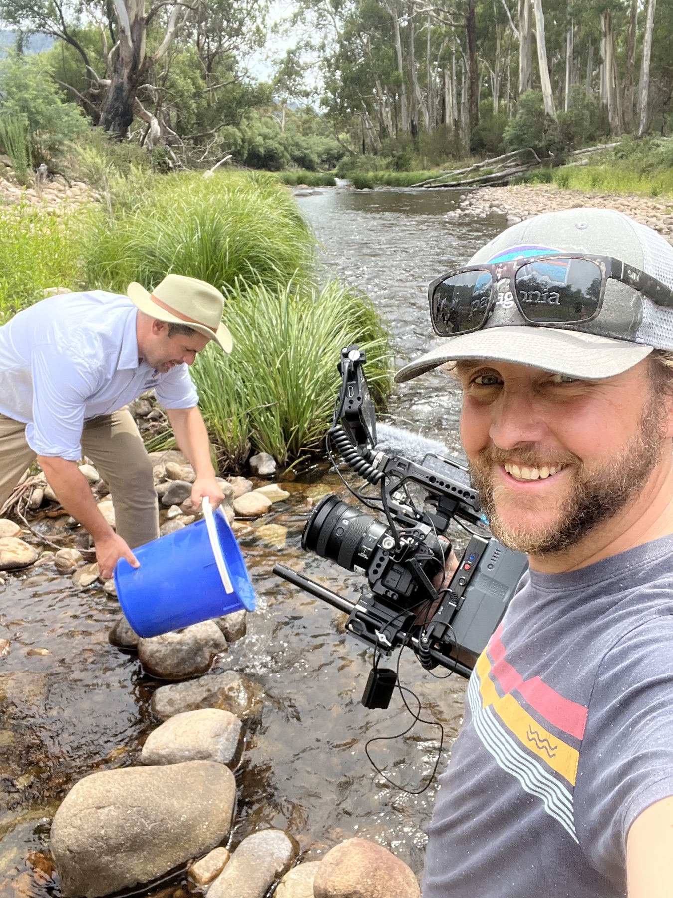 Filming alongside fieldwork at a rocky creek
