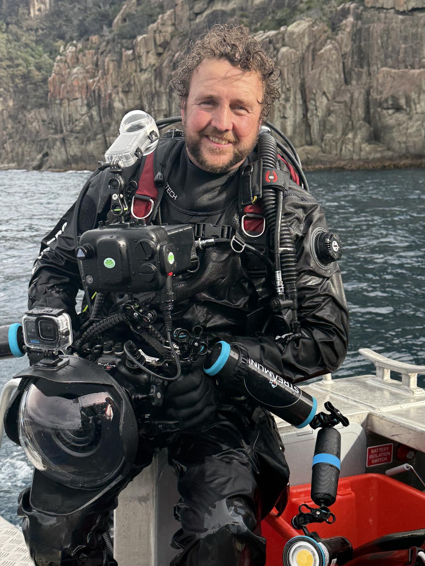 Preparing an underwater camera aboard a boat